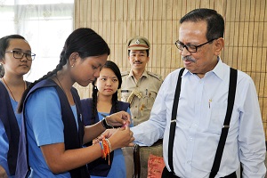 The Students of VKV School, Itanagar  tying Rakhi to the Governor of Arunachal Pradesh Shri JP Rajkhowa  on the occasion of Raksha  Bandhan at Raj Bhavan on 18th August2016.